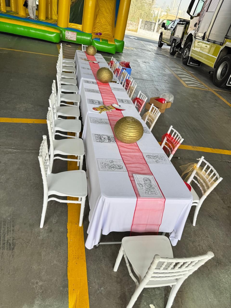 Styled kids banquet row with pink runner and table settings
